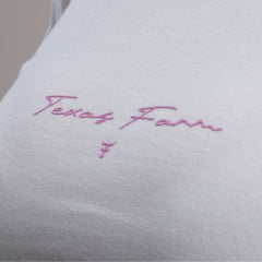 Camiseta Feminina Texas Farm Baby Look Manga Curta Bege Com Logo Rosa Estampado Ref:CF334